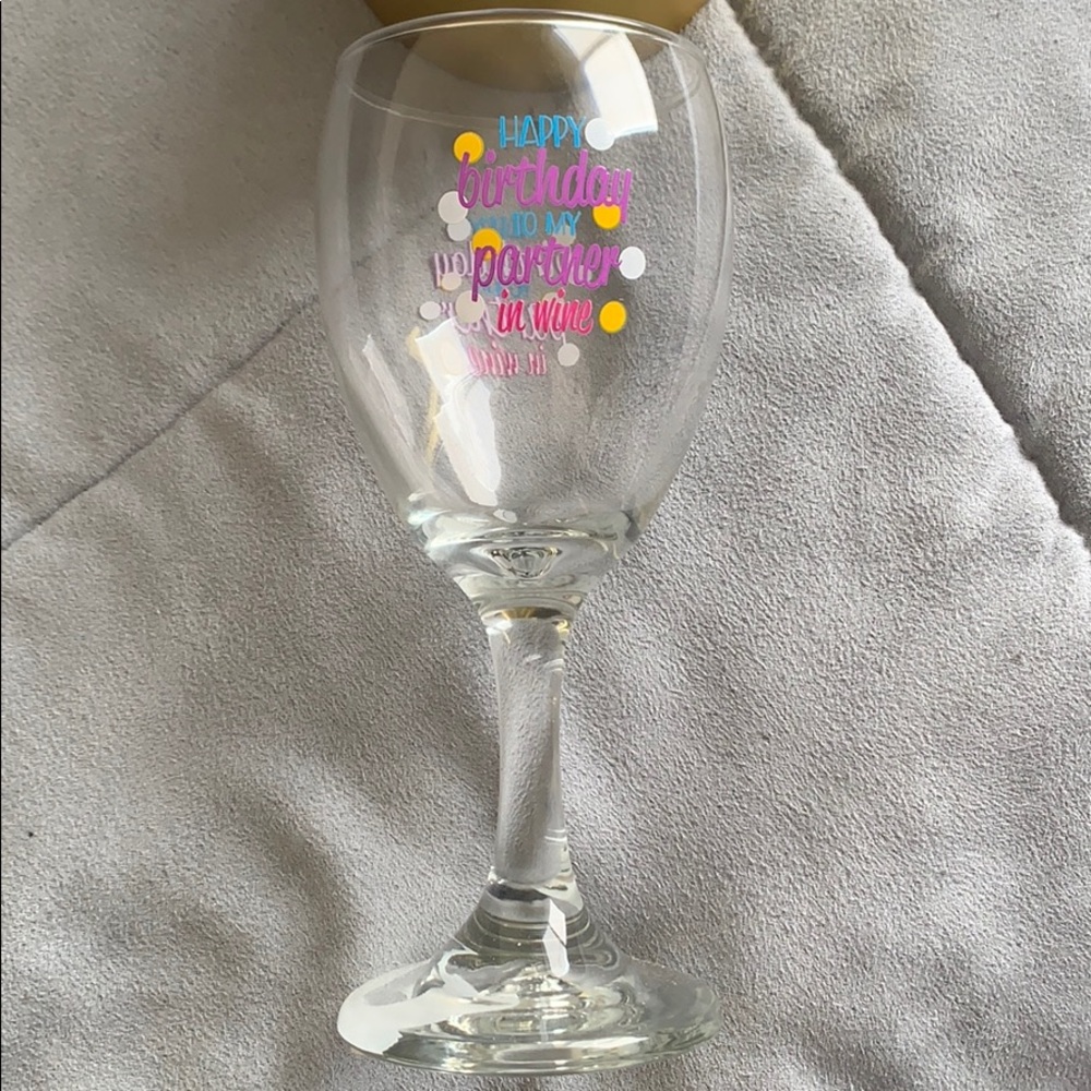 Wine glass with gold box holder.